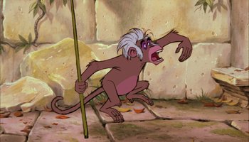 Movie still from “The Jungle Book” (1967), directed by Wolfgang Reitherman – A cartoon of a monkey holding a stick in its mouth; Medium shot, Low angle