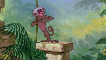 Movie still from “The Jungle Book” (1967), directed by Wolfgang Reitherman – A painting of a monkey standing on top of a stone pillar; Wide shot, Low angle