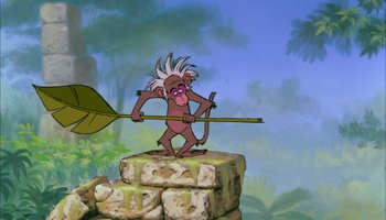 Movie still from “The Jungle Book” (1967), directed by Wolfgang Reitherman – An animated monkey holding a bow and arrow; Wide shot, Low angle