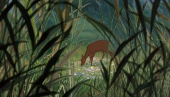 Movie still from “The Jungle Book” (1967), directed by Wolfgang Reitherman – A deer is standing in the grass looking at the flowers; Wide shot, High angle