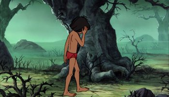 Movie still from “The Jungle Book” (1967), directed by Wolfgang Reitherman – A cartoon of a man in a red swim trunks standing in front of a tree; Wide shot, Low angle