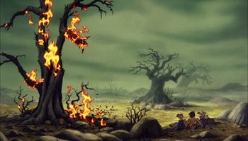 Movie still from “The Jungle Book” (1967), directed by Wolfgang Reitherman – Two children sitting on the ground in front of a burning tree; Extreme Wide shot, High angle