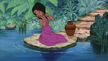 Movie still from “The Jungle Book” (1967), directed by Wolfgang Reitherman – A woman in a pink dress sitting on top of a rock in the middle of a river; Wide shot, High angle