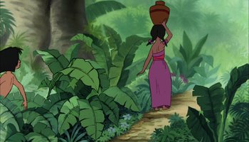 Movie still from “The Jungle Book” (1967), directed by Wolfgang Reitherman – An animated scene of a woman carrying a vase; Wide shot, Over the shoulder angle