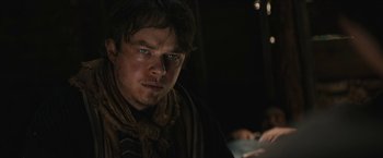 Movie still from “The Kid” (2019), directed by Vincent D'Onofrio – A person wearing a scarf; Close Up shot, Over the shoulder angle