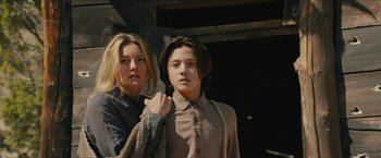 Movie still from “The Kid” (2019), directed by Vincent D'Onofrio – Two young people standing next to each other; Medium shot, Low angle