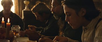 Movie still from “The Kid” (2019), directed by Vincent D'Onofrio – A group of people sitting at a table with papers; Close Up shot, Over the shoulder angle