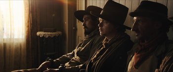 Movie still from “The Kid” (2019), directed by Vincent D'Onofrio – A man and a woman sitting next to each other; Medium shot, Low angle