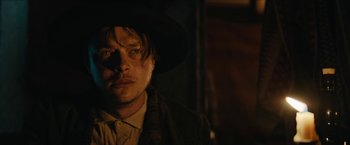 Movie still from “The Kid” (2019), directed by Vincent D'Onofrio – A person wearing a hat; Close Up shot, Low angle