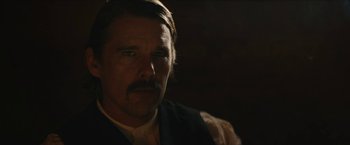 Movie still from “The Kid” (2019), directed by Vincent D'Onofrio – A person wearing a vest; Close Up shot, Over the shoulder angle