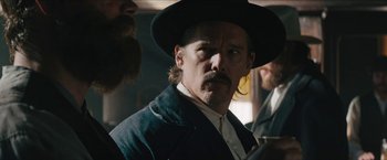 Movie still from “The Kid” (2019), directed by Vincent D'Onofrio – A person wearing a hat; Close Up shot, Over the shoulder angle