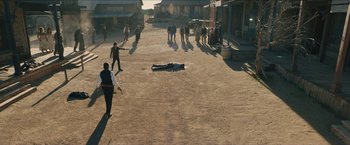 Movie still from “The Kid” (2019), directed by Vincent D'Onofrio – A group of people walking down a street; Extreme Wide shot, High angle