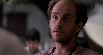 Movie still from “The Killing Fields” (1984), directed by Roland Joffé – A person with a beard; Close Up shot, Low angle