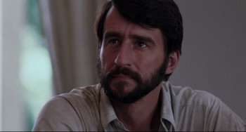 Movie still from “The Killing Fields” (1984), directed by Roland Joffé – A person with a beard; Close Up shot, Low angle