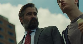 Movie still from “The Killing of a Sacred Deer” (2017), directed by Yorgos Lanthimos – A man in a suit and a red tie; Close Up shot, Low angle