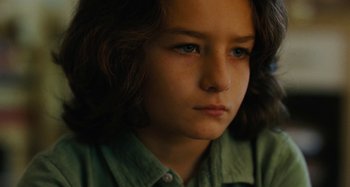 Movie still from “The Killing of a Sacred Deer” (2017), directed by Yorgos Lanthimos – A person with long brown hair; Close Up shot, High angle