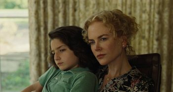 Movie still from “The Killing of a Sacred Deer” (2017), directed by Yorgos Lanthimos – A woman sitting next to a young girl in front of a curtain; Close Up shot, Over the shoulder angle