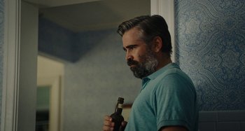 Movie still from “The Killing of a Sacred Deer” (2017), directed by Yorgos Lanthimos – A man with a beard holding a bottle of beer; Close Up shot, Over the shoulder angle