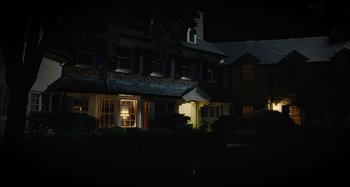 Movie still from “The Killing of a Sacred Deer” (2017), directed by Yorgos Lanthimos – A night time picture of a house in the dark; Extreme Wide shot, Low angle
