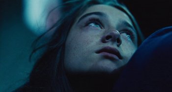 Movie still from “The Killing of a Sacred Deer” (2017), directed by Yorgos Lanthimos – A person looking up at the sky; Extreme Close Up shot, Low angle