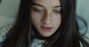 Movie still from “The Killing of a Sacred Deer” (2017), directed by Yorgos Lanthimos – A young woman's eyes and face; Extreme Close Up shot, High angle