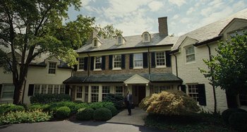 Movie still from “The Killing of a Sacred Deer” (2017), directed by Yorgos Lanthimos – A man walking in front of a large house; Extreme Wide shot, High angle