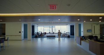 Movie still from “The Killing of a Sacred Deer” (2017), directed by Yorgos Lanthimos – A man standing in an empty office building; Extreme Wide shot, High angle
