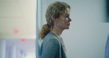 Movie still from “The Killing of a Sacred Deer” (2017), directed by Yorgos Lanthimos – A woman standing in front of a mirror; Close Up shot, Over the shoulder angle