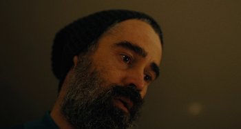 Movie still from “The Killing of a Sacred Deer” (2017), directed by Yorgos Lanthimos – A man with a beard wearing a black hat; Extreme Close Up shot, Over the shoulder angle