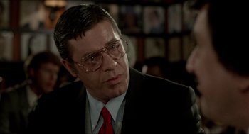 Movie still from “The King of Comedy” (1982), directed by Martin Scorsese – An older man in a suit and tie; Close Up shot, Over the shoulder angle