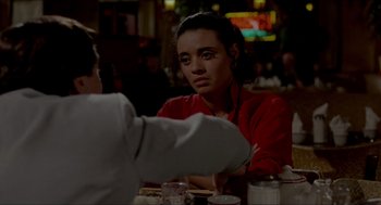 Movie still from “The King of Comedy” (1982), directed by Martin Scorsese – A woman sitting at a table in front of a man; Close Up shot, Over the shoulder angle