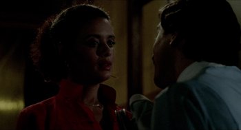 Movie still from “The King of Comedy” (1982), directed by Martin Scorsese – A man and a woman talking in a dark room; Close Up shot, Over the shoulder angle