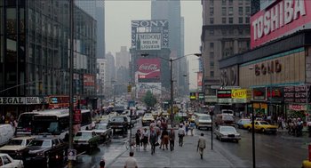 Movie still from “The King of Comedy” (1982), directed by Martin Scorsese – A busy city street filled with lots of traffic; Extreme Wide shot, High angle