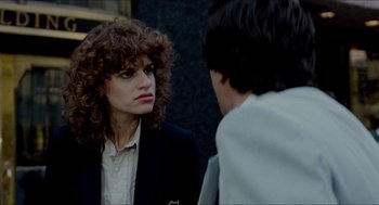 Movie still from “The King of Comedy” (1982), directed by Martin Scorsese – A woman with curly hair is talking to a man; Close Up shot, Over the shoulder angle