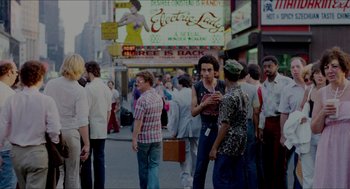 Movie still from “The King of Comedy” (1982), directed by Martin Scorsese – A crowd of people walking down a street; Wide shot, Over the shoulder angle