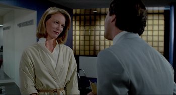 Movie still from “The King of Comedy” (1982), directed by Martin Scorsese – A woman wearing a robe talking to a man in a suit; Medium shot, Over the shoulder angle