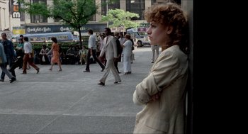 Movie still from “The King of Comedy” (1982), directed by Martin Scorsese – A woman leaning against a wall in the middle of the street; Wide shot, Over the shoulder angle