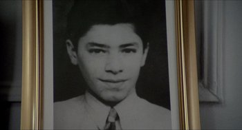 Movie still from “The King of Comedy” (1982), directed by Martin Scorsese – An old black and white photo of a man in a tie; Extreme Close Up shot, High angle