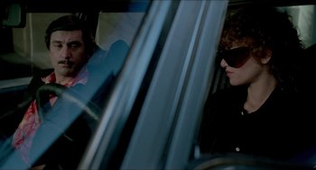 Movie still from “The King of Comedy” (1982), directed by Martin Scorsese – A man and a woman sitting in the back of a car; Medium shot, Over the shoulder angle