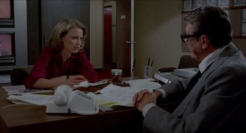 Movie still from “The King of Comedy” (1982), directed by Martin Scorsese – A woman sitting at a table with a man; Medium shot, Over the shoulder angle