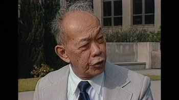 Movie still from “The Kingmaker” (2019), directed by Lauren Greenfield – An older asian man in a suit and tie; Close Up shot, Low angle