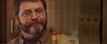 Movie still from “The Kings of Summer” (2013), directed by Jordan Vogt-Roberts – A person with a beard wearing glasses; Close Up shot, Over the shoulder angle