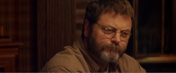 Movie still from “The Kings of Summer” (2013), directed by Jordan Vogt-Roberts – A person with a beard wearing glasses; Close Up shot, Over the shoulder angle
