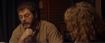 Movie still from “The Kings of Summer” (2013), directed by Jordan Vogt-Roberts – A man and a woman sitting at a table talking to each other; Close Up shot, Over the shoulder angle