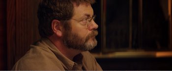 Movie still from “The Kings of Summer” (2013), directed by Jordan Vogt-Roberts – A person with a beard wearing glasses; Close Up shot, Over the shoulder angle