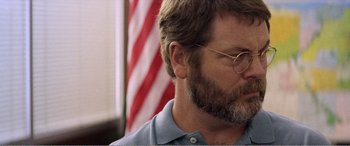 Movie still from “The Kings of Summer” (2013), directed by Jordan Vogt-Roberts – A person with a flag in the background; Close Up shot, Over the shoulder angle