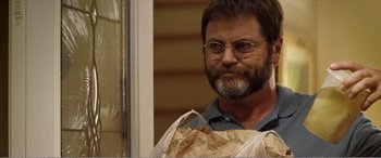 Movie still from “The Kings of Summer” (2013), directed by Jordan Vogt-Roberts – A person holding a bag of food; Close Up shot, Over the shoulder angle