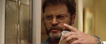 Movie still from “The Kings of Summer” (2013), directed by Jordan Vogt-Roberts – A person holding a remote control; Close Up shot, Over the shoulder angle