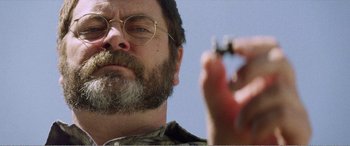 Movie still from “The Kings of Summer” (2013), directed by Jordan Vogt-Roberts – A person holding a cell phone; Extreme Close Up shot, Low angle