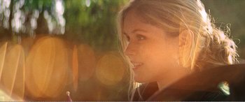 Movie still from “The Kings of Summer” (2013), directed by Jordan Vogt-Roberts – A beautiful young lady with long blonde hair; Close Up shot, Over the shoulder angle